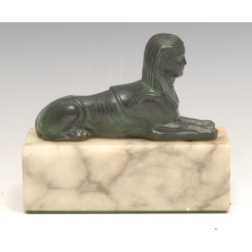 3087 - A Grand Tour style verdigris patinated spelter cabinet model, of a sphinx, rectangular marble base, ... 