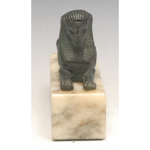 3087 - A Grand Tour style verdigris patinated spelter cabinet model, of a sphinx, rectangular marble base, ... 