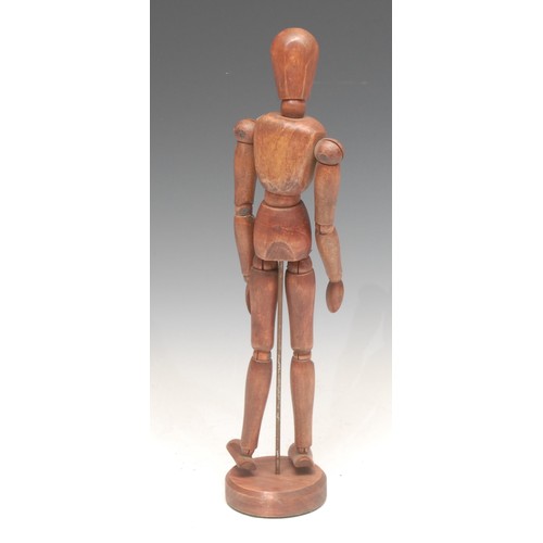 3207 - A table top artist's lay model, the figure typically articulated, circular base, 33cm high