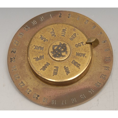 3270 - An early 20th century brass promotional perpetual desk calendar, for Banca Commerciale Italiana, Lon... 