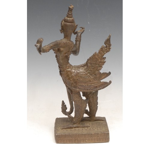 3255 - An Asian bronze figurine of Garuda, the divine vehicle of Vishnu, with relaxed wings, on a stone bas... 