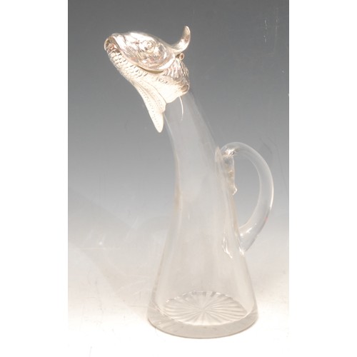 3655 - An early 20th century claret jug, mounted with a white metal collar and cover as a fish head, loop h... 