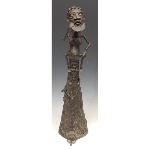 3779 - Tribal Art - a West African bronze figure, atop a lofty base, cast in the Benin manner, probably Dog... 