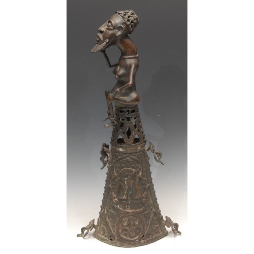 3779 - Tribal Art - a West African bronze figure, atop a lofty base, cast in the Benin manner, probably Dog... 