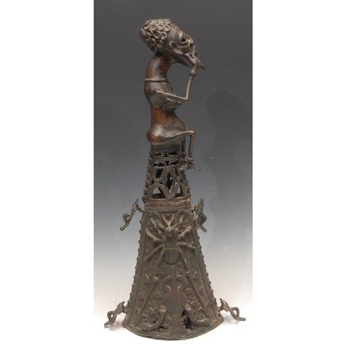 3779 - Tribal Art - a West African bronze figure, atop a lofty base, cast in the Benin manner, probably Dog... 