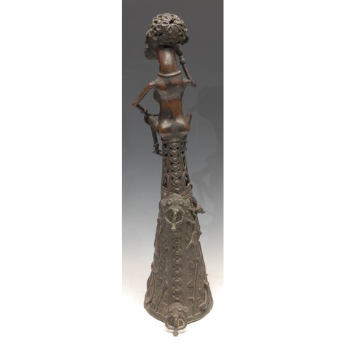 3779 - Tribal Art - a West African bronze figure, atop a lofty base, cast in the Benin manner, probably Dog... 