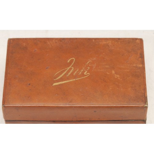 3294 - An early 20th century leather-clad travelling inkwell, hinked cover enclosing twin compartments, 9.5... 