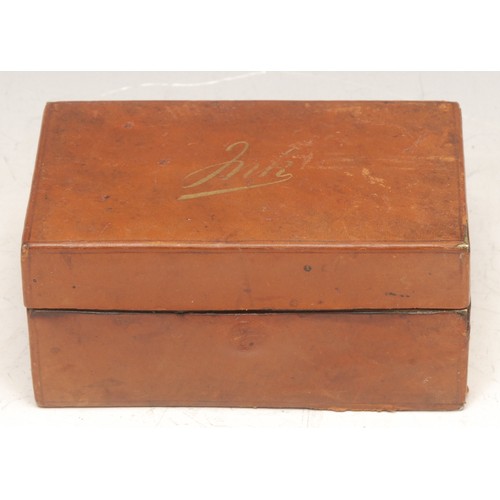 3294 - An early 20th century leather-clad travelling inkwell, hinked cover enclosing twin compartments, 9.5... 