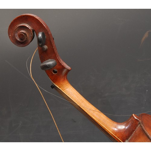 3727 - A violin, the one piece back 35.5cm long excluding button, paper label printed Celebre Vosgien, ebon... 