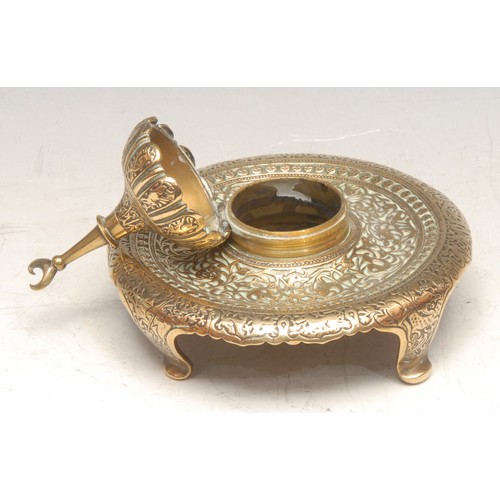 3531 - A 19th century brass inkwell, in the Indo-Saracenic taste, the hinged cover as an Islamic qubba dome... 