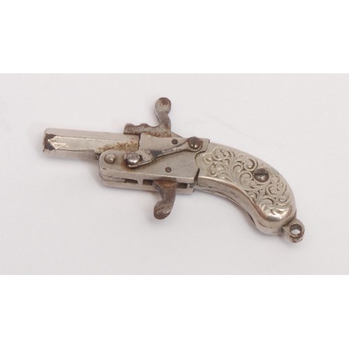 3299 - An early 20th century novelty watch fob pistol, hexagonal barrel, two-piece grip chased with scrolli... 