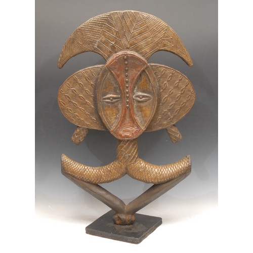 3771 - Tribal Art - a Kota copper and hardwood reliquary guardian figure (mbulu ngulu), Gabon, 63cm high  
... 