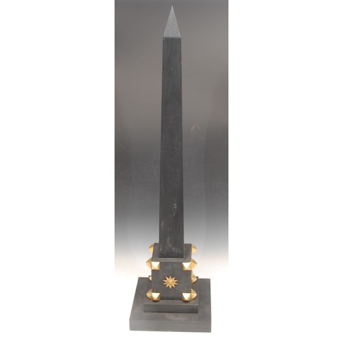 3424 - Interior Decoration - a large parcel-gilt and ebonised library obelisk, stepped base, 91cm high