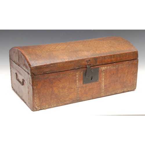 3245 - An 18th century tooled leather table top document trunk, iron lockplate and hasp, carrying handles t... 