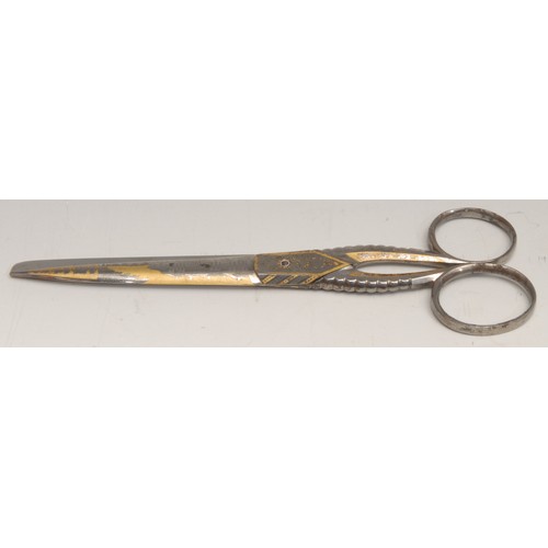 3138 - A pair of 19th century gilt damascened scissors, decorated with views of a country house, 19cm long