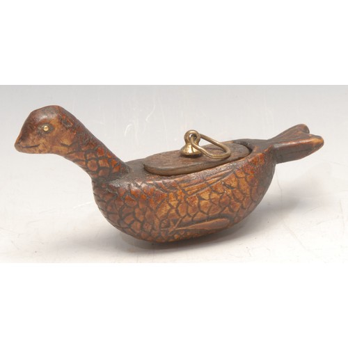 3565 - A 19th century folk art treen snuff box, naively carved as a water fowl, 11.5cm long