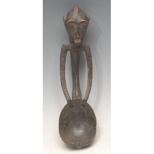 3767 - Tribal Art - a Dayak figural spoon, 18cm long, Borneo, Indonesia