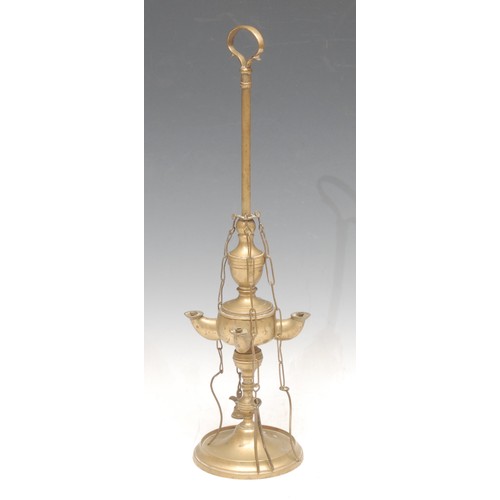 3243 - An 18th century style brass spout lamp, 30cm high