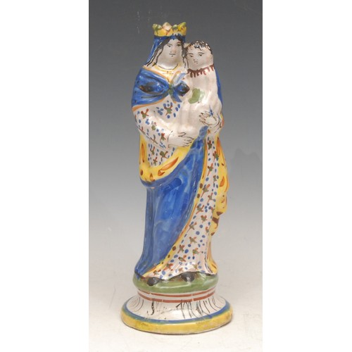3061 - A French faience figure, Madonna and Child, 23cm high, late 19th century