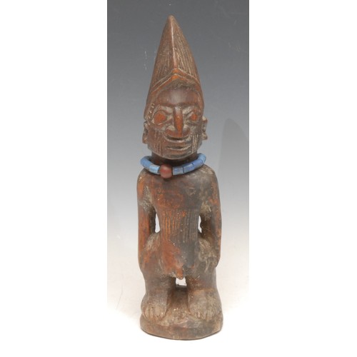 3511 - Tribal Art - a Yoruba Ibeji figure, 28cm high, Nigeria