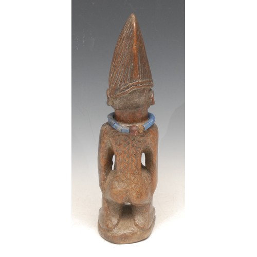 3511 - Tribal Art - a Yoruba Ibeji figure, 28cm high, Nigeria