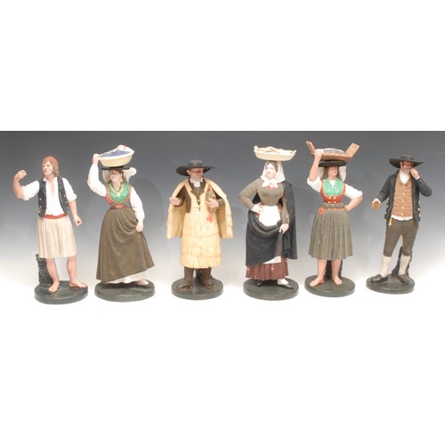 3195 - A set of six South European terracotta creche figures, modelled as characters from daily life, the t... 