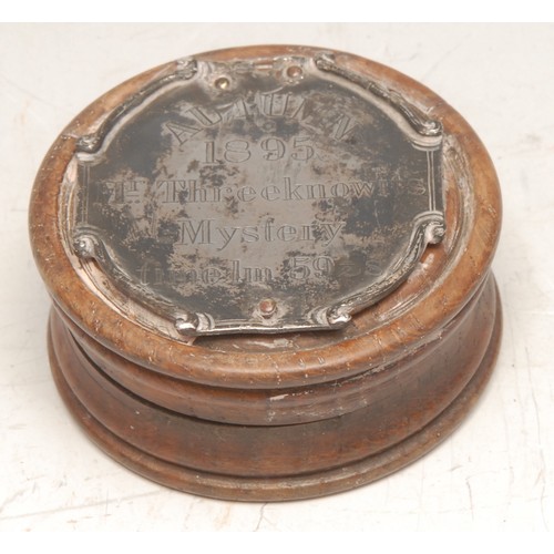 3335 - An interesting 19th century turned oak circular snuff box, the push-fitting cover with silver colour... 