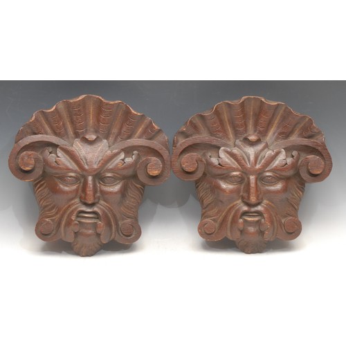 3502 - Treen - a pair of Baroque design oak carved Green Man masks, picked out in gilt, 28cm high, 28.5cm w... 