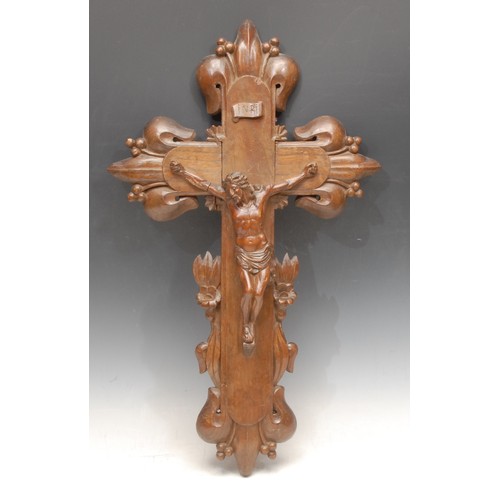 3065 - A French softwood corpus Christi, the oak cross carved with carved with lillies, 50cm long, c. 1900