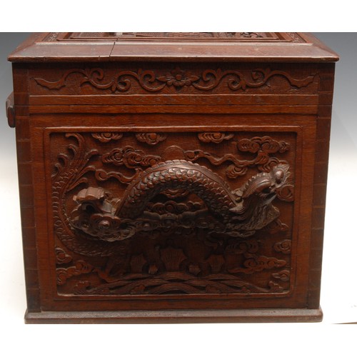 3028 - A Chinese camphor wood dowry chest, carved in the Cantonese taste, with panels depicting every day l... 