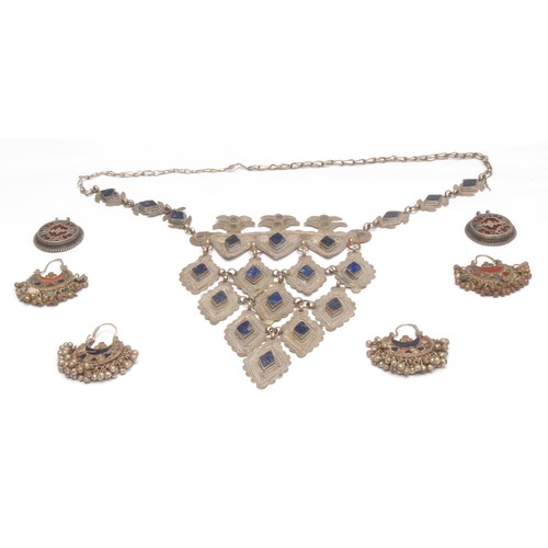 3748 - A collection of North African silver coloured metal jewellery, set with lapis lazuli and other speci... 