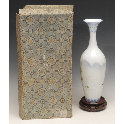 3041 - A Chinese slender baluster vase, painted in polychrome with a monumental landscape, 31.5cm high, sea... 