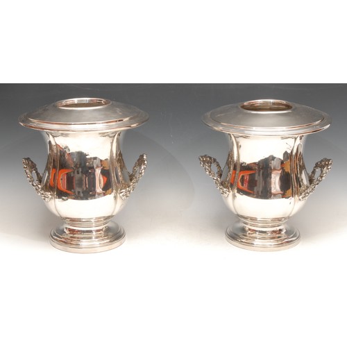 3165 - A pair of Regency style silver plated campana wine coolers, acanthus leaf handles, 27cm high