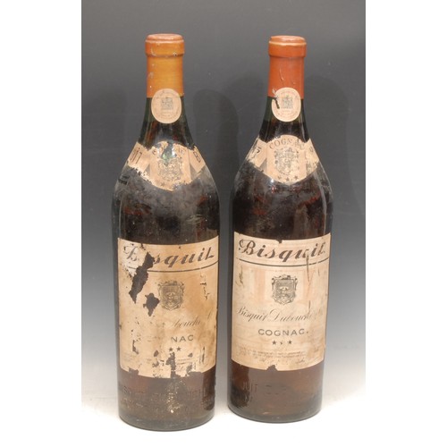 3160 - A pair of large French dummy wine bottles, Bisquit Doubouche Cognac, 49cm high