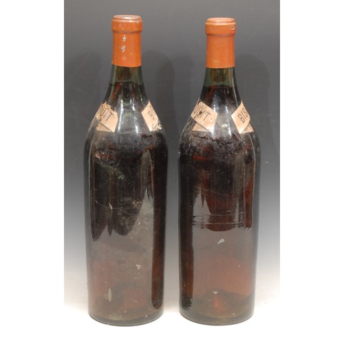 3160 - A pair of large French dummy wine bottles, Bisquit Doubouche Cognac, 49cm high