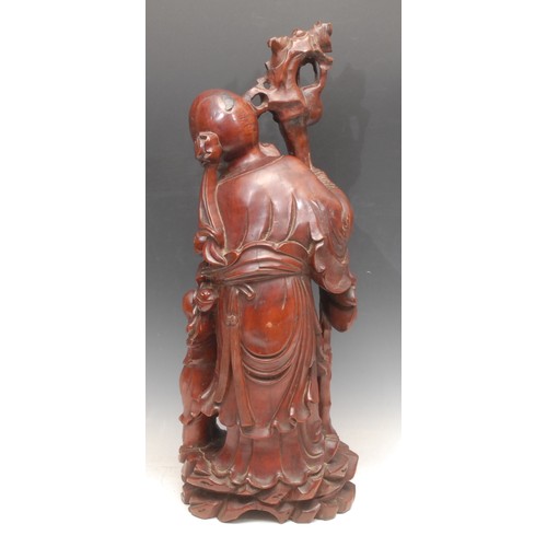 3277 - An early 20th century Chinese hardwood figure, carved as Shoulao, attended by a boy, 54cm high