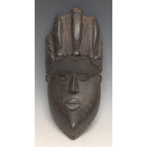 3758 - Tribal Art - a Bassa [Basa] geh-naw mask, concave features, 25cm long, Liberia, West Africa