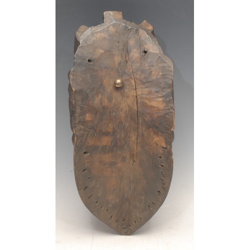 3758 - Tribal Art - a Bassa [Basa] geh-naw mask, concave features, 25cm long, Liberia, West Africa