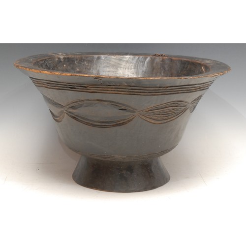 3761 - Tribal Art - a Dan bowl, flared rim above a geometric band of interlaced ellipses, skirted base, 35c... 