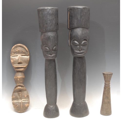 3780 - Tribal Art - a West African figural rhythm pounder, 48.5cm long; another; etc (4)