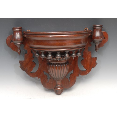 3323 - An Edwardian mahogany wall bracket, turned and gadrooned central carving flanked by a pair of candle... 