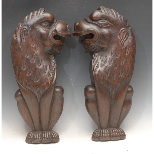 3699 - Treen - a pair of Mannerist style French wood carvings, of lions, 40.5cm high each