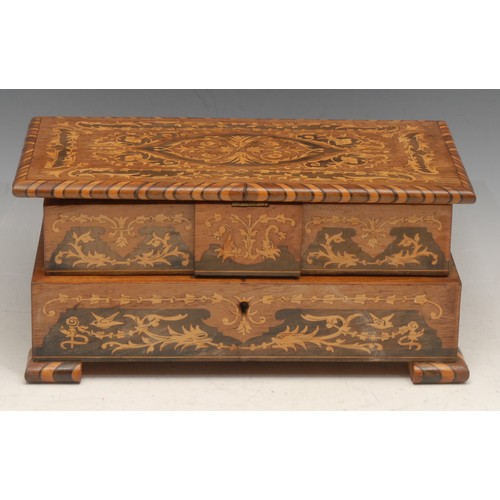 3338 - An Italian marquetry musical vanity case, the inlaid hinged cover revealing a cushioned interior, 11... 