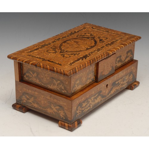 3338 - An Italian marquetry musical vanity case, the inlaid hinged cover revealing a cushioned interior, 11... 