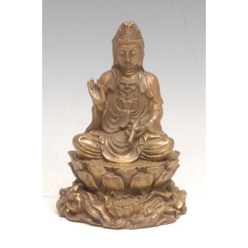 3586 - A 19th century Indian bronze, of Buddha, he sits on a lotus leaf, 10cm high overall