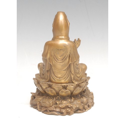 3586 - A 19th century Indian bronze, of Buddha, he sits on a lotus leaf, 10cm high overall