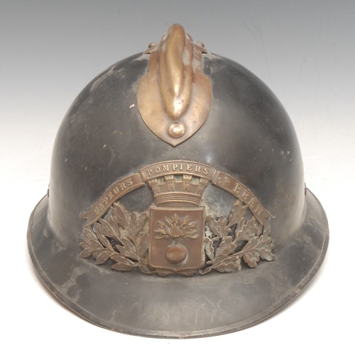 3385 - Fire Brigade History - an early 20th century French brass mounted and black painted fireman's helmet... 