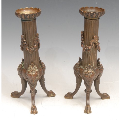 3162 - A pair of Louis XVI Revival bronze candlesticks, the tripod supports cast with Venus masks, 18cm hig... 