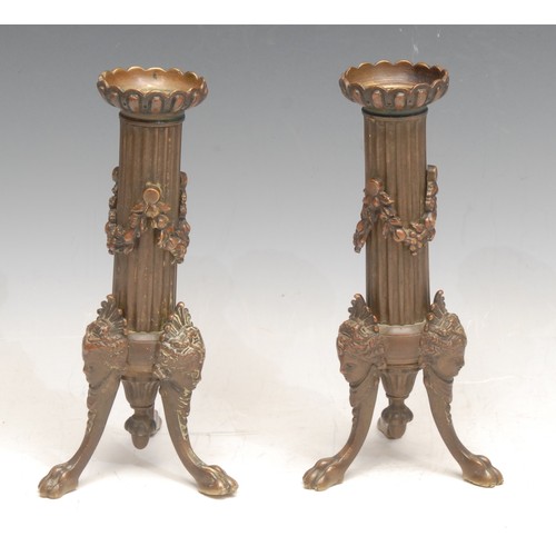3162 - A pair of Louis XVI Revival bronze candlesticks, the tripod supports cast with Venus masks, 18cm hig... 