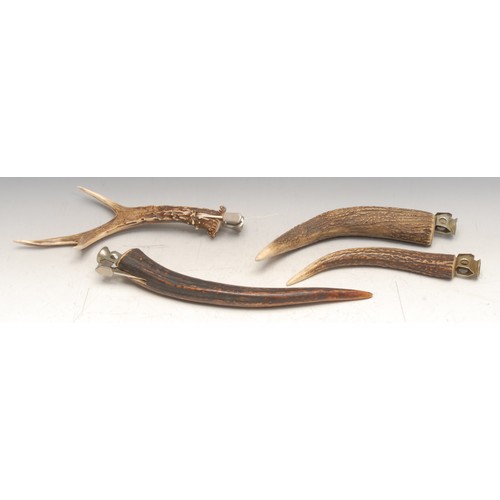 3312 - An early 20th century stag antler cigar piercer, 27cm long; others, similar (4)